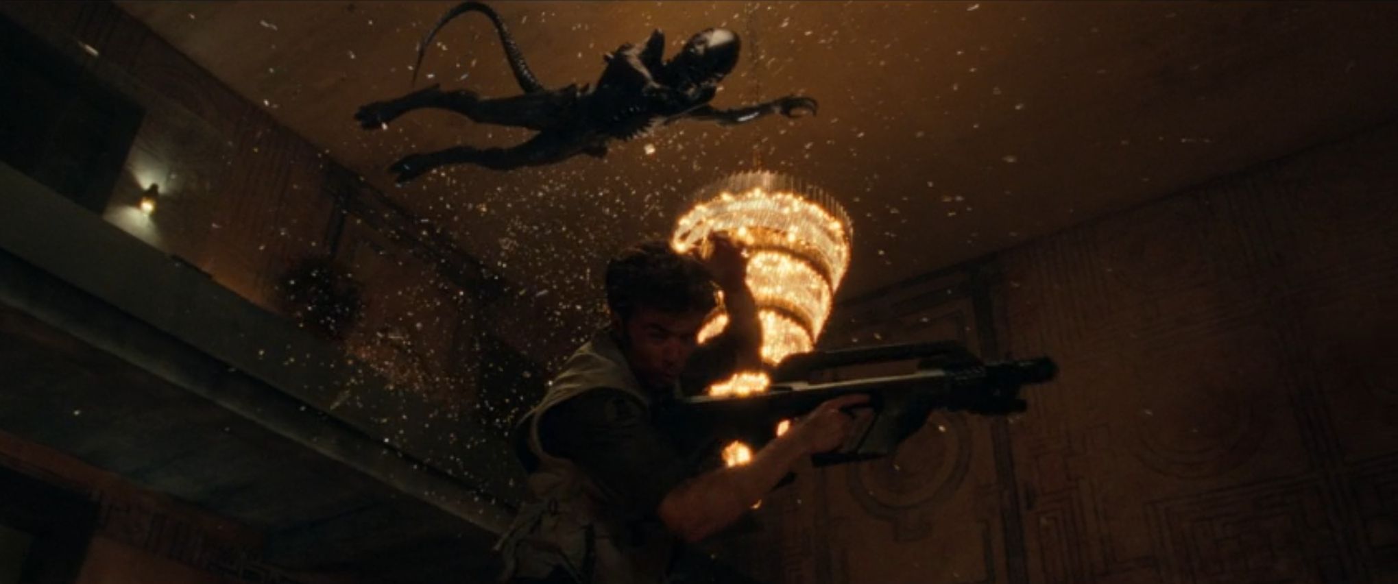 A Xenomorph jumps through the air over the medic.
