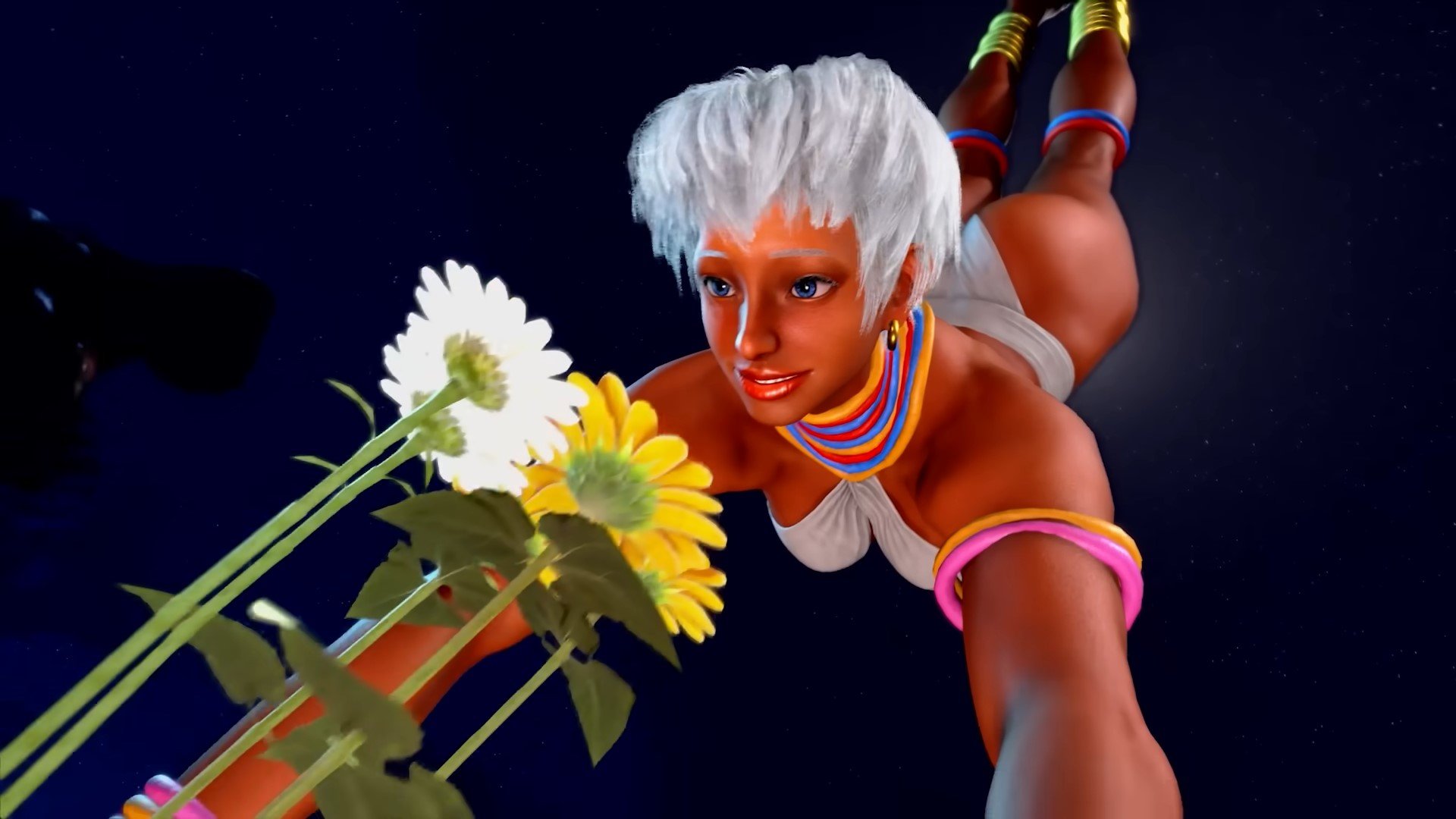 Elena does a handstand over some flowers in her original costume.