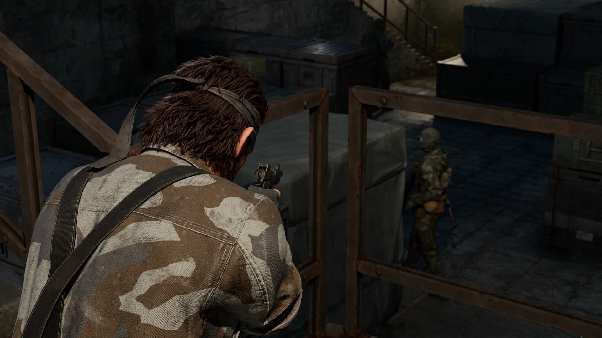 Snake aims a gun at an enemy.