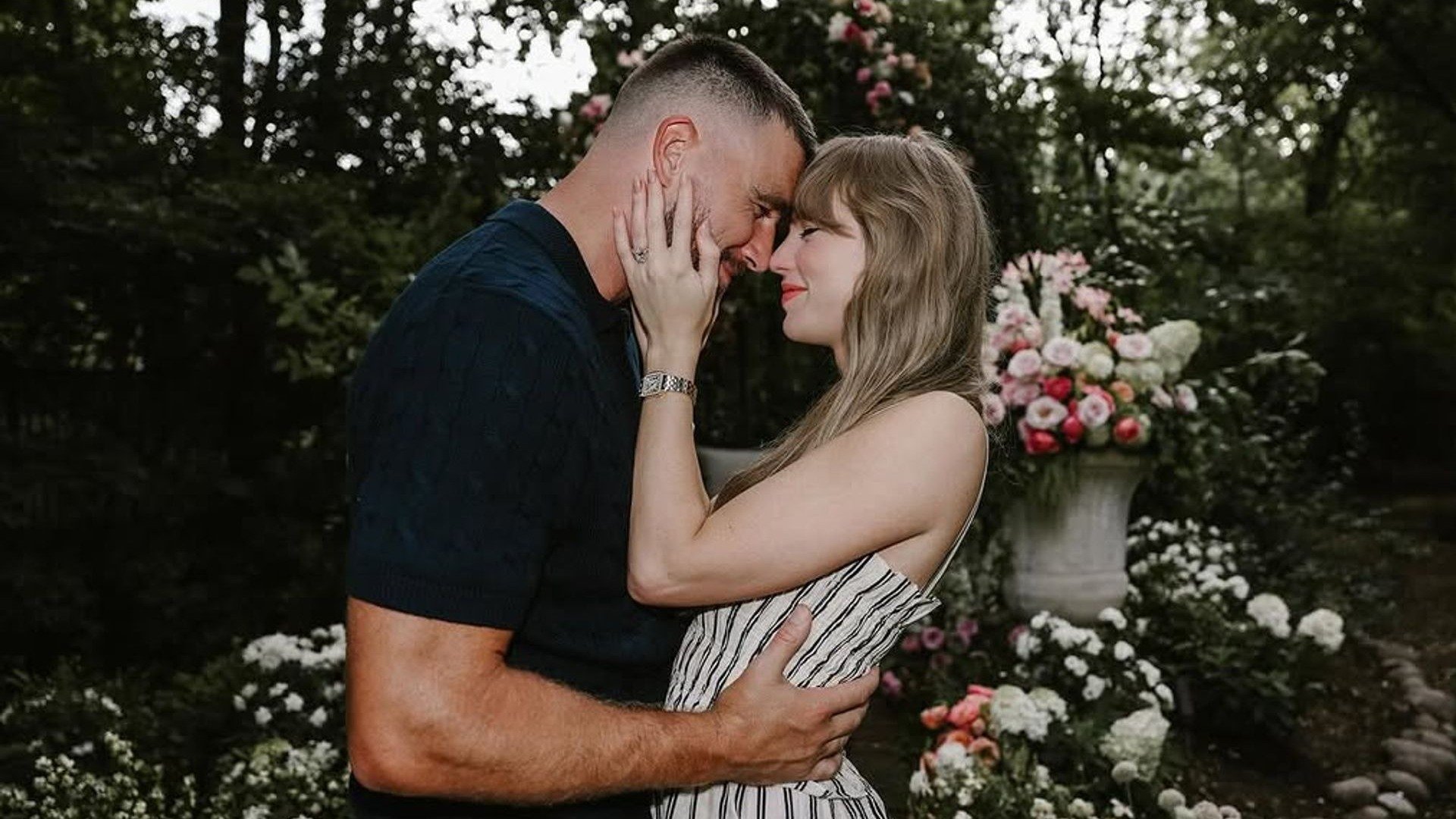 Taylor Swift and Travis Kelce embrace in engagement photo