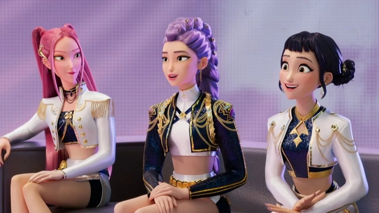 Huntr/x sitting on a couch during an interview.